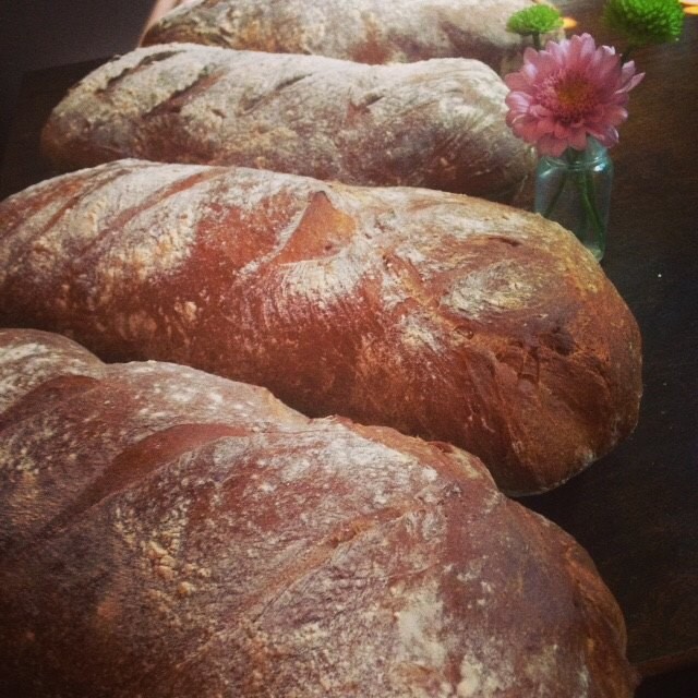 Fresh baked, crusty housemade whole wheat bread comes out of the oven right before dinner service. Via Fat Goose Facebook.